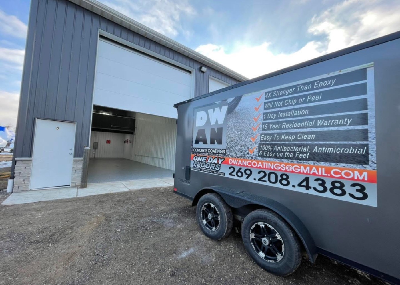 Dwan Services trailer outside commercial metal building