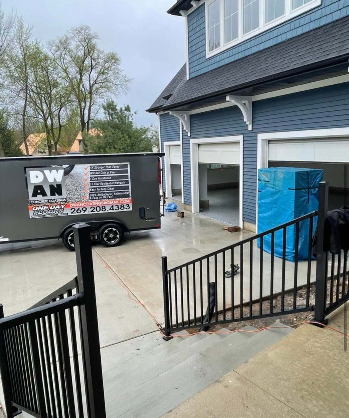 Dwan Services truck at residential garage job site